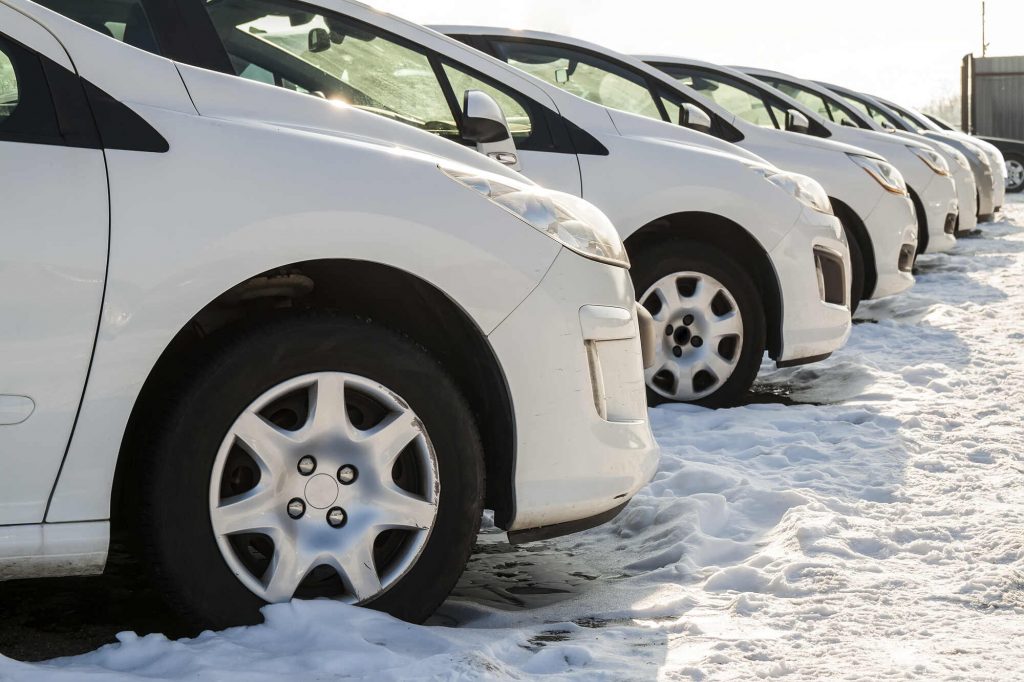 Fleet of business cars parked on a row