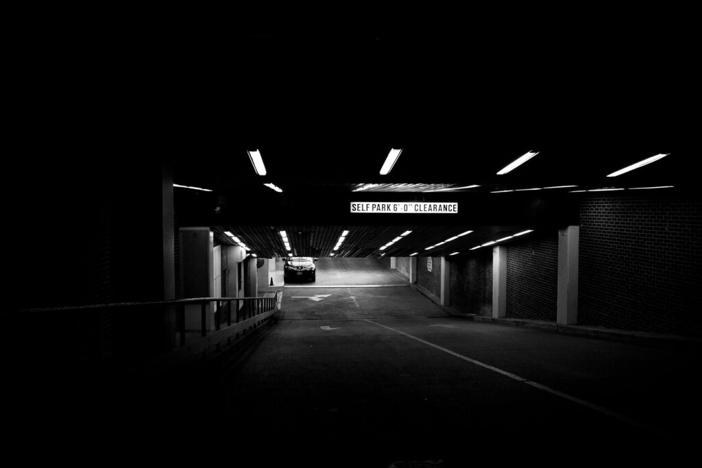 Car parked in a dimly lit car park